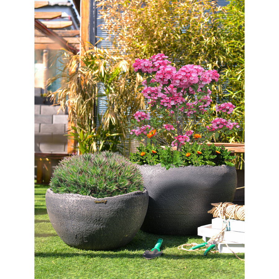 a sturdy and weather-resistant flower pot crafted from Jun porcelain clay with polymer resin infusion. Suitable for indoor and outdoor use, perfect for displaying flowers or green plants. Ideal for gardening enthusiasts, available for purchase now.