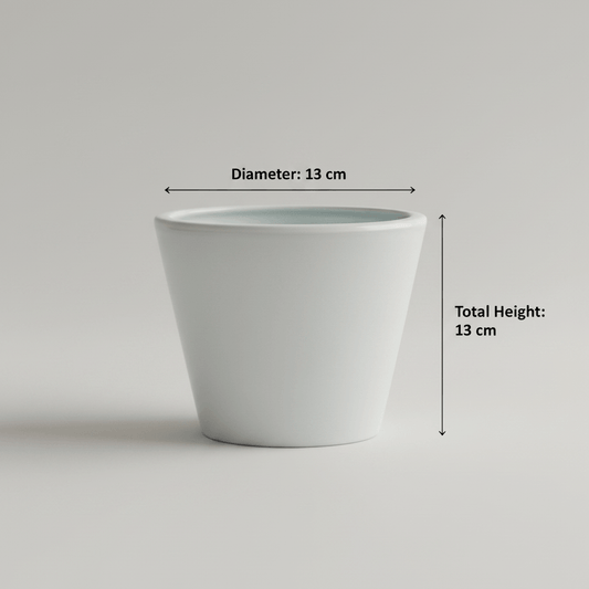 Glossy white ceramic planter on a tabletop