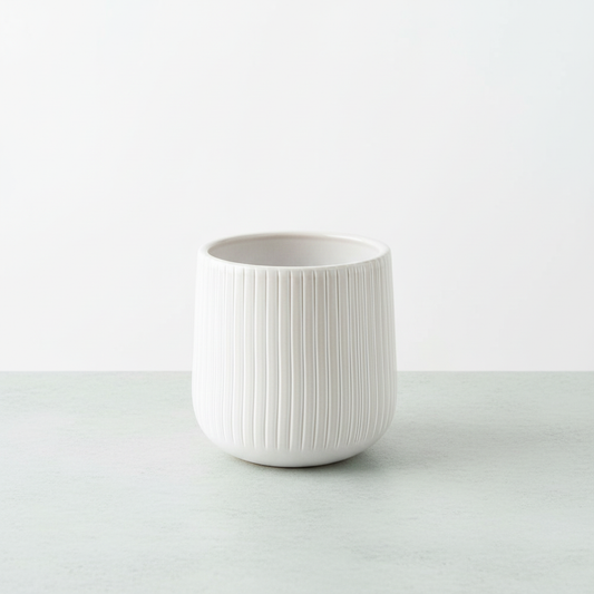 Bright HD white ribbed ceramic planter on tabletop
